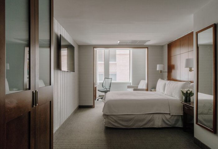 Club Quarters Hotel, Central Loop guest room. Modern, gay-friendly hotel with bed, desk, and TV. Ideal for gay travelers in Chicago.