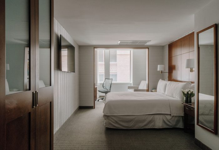 Club Quarters Hotel, Central Loop guest room. Modern, gay-friendly hotel with bed, desk, and TV. Ideal for gay travelers in Chicago.