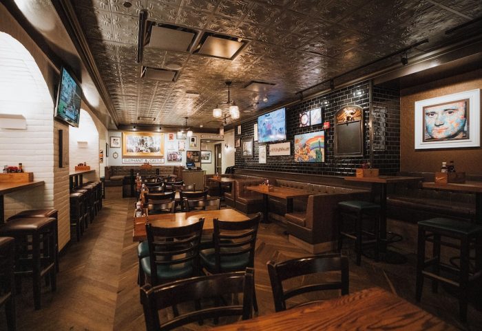 Club Quarters Hotel, Central Loop's restaurant. Gay-friendly hotel with dark wood tables, booths, & bar. TVs & framed art adorn the walls.