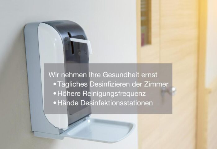 Hand sanitizer dispenser at Cocoon Sendlinger Tor, a gay-friendly hotel. Hygiene measures for gay travelers in Munich.