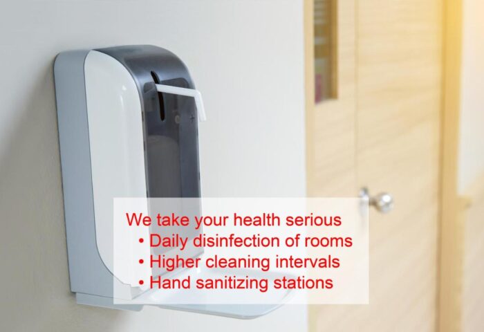 Sanitizing station at Cocoon Sendlinger Tor, a gay-friendly hotel. Health and safety measures for gay travel in Munich.