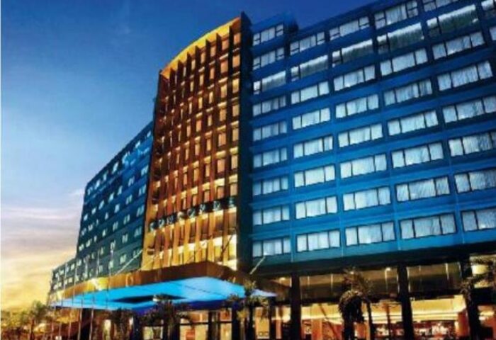 Exterior of Concorde Hotel Kuala Lumpur, a gay-friendly hotel with modern architecture and illuminated facade at dusk.