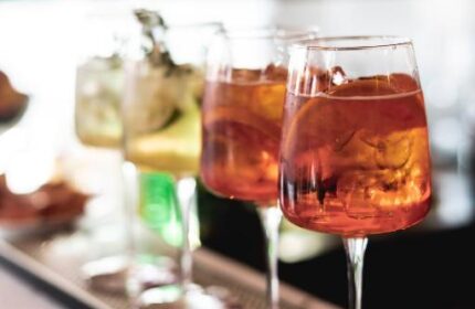 Condominio Monti Boutique Hotel: Cocktails lined up at the bar. Gay-friendly hotel with a stylish atmosphere. Perfect for gay travel in Rome.