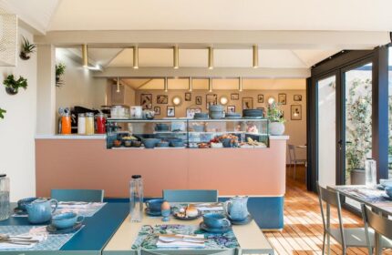 Condominio Monti Boutique Hotel's breakfast bar. This gay-friendly hotel offers a buffet with fresh food and drinks in a stylish setting.