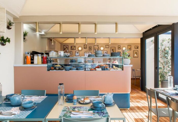 Condominio Monti Boutique Hotel's breakfast bar. This gay-friendly hotel offers a buffet with fresh food and drinks in a stylish setting.