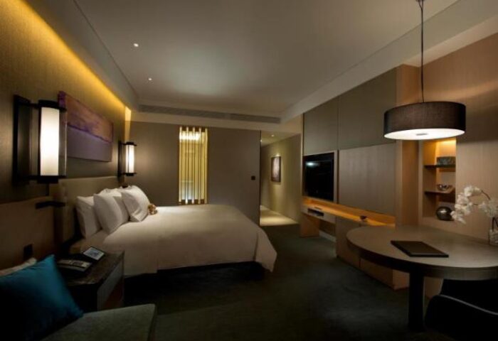 Conrad Seoul gay-friendly hotel room. Modern design, king bed, desk, TV. A luxury travel destination for gay men visiting Seoul, South Korea.