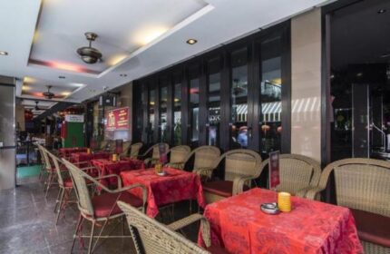 Copa Hotel's outdoor dining area. Gay-friendly hotel with tables set for guests, creating a welcoming atmosphere for gay travelers.