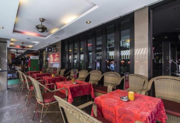 Copa Hotel's outdoor dining area. Gay-friendly hotel with tables set for guests, creating a welcoming atmosphere for gay travelers.