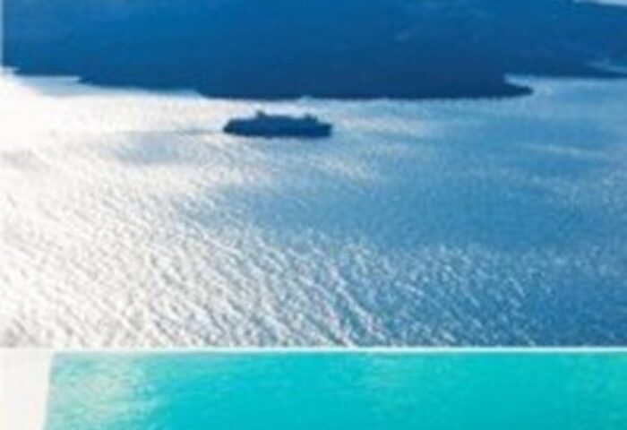 Cosmopolitan Suites gay-friendly hotel view. Infinity pool overlooking the Aegean Sea with a boat and island in the distance. Gay travel advice.