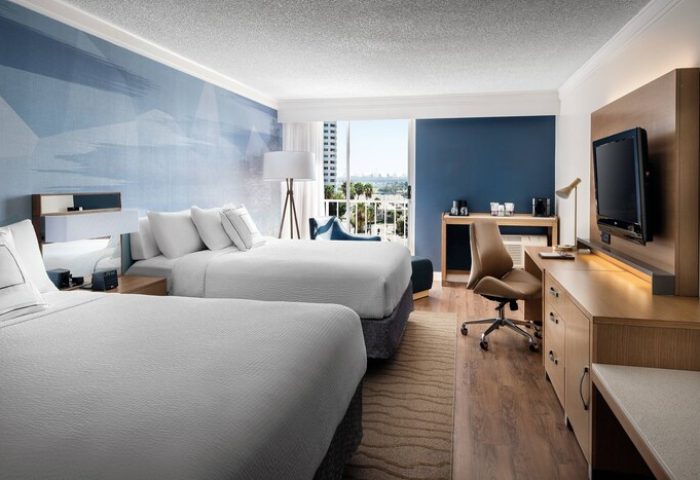 Courtyard Long Beach Downtown hotel room. Two beds, desk, TV, and balcony. Gay-friendly hotel in Long Beach, CA for gay men travel.
