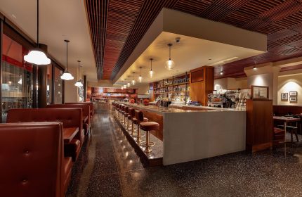 Courtyard San Francisco Downtown/Van Ness Ave gay-friendly hotel bar. Booths, bar stools, liquor bottles, & wood ceiling.