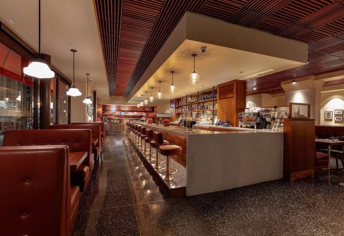 Courtyard San Francisco Downtown/Van Ness Ave gay-friendly hotel bar. Booths, bar stools, liquor bottles, & wood ceiling.