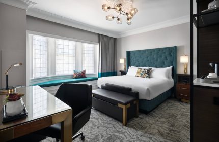 Courtyard San Francisco Downtown/Van Ness Ave gay-friendly hotel room. King bed, desk, and window seat in a modern, well-lit room.