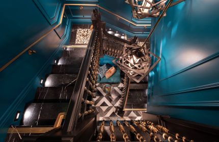 Courtyard San Francisco Downtown/Van Ness Ave hotel's stylish staircase. Black marble steps, teal walls, & modern lighting. Gay-friendly hotel.