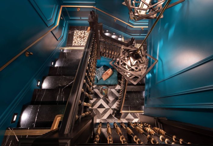 Courtyard San Francisco Downtown/Van Ness Ave hotel's stylish staircase. Black marble steps, teal walls, & modern lighting. Gay-friendly hotel.