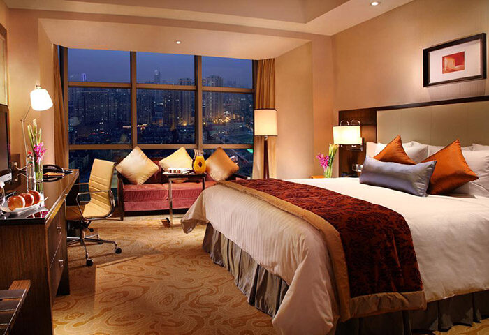 Courtyard by Marriott Shanghai Xujiahui hotel room. Night view of Shanghai. Gay-friendly hotel for gay men travelers.