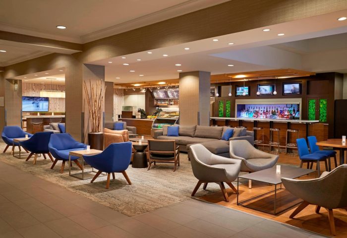 Lobby lounge at the gay-friendly Courtyard by Marriott Toronto Downtown hotel. Bar, seating areas, and modern decor for gay travelers.
