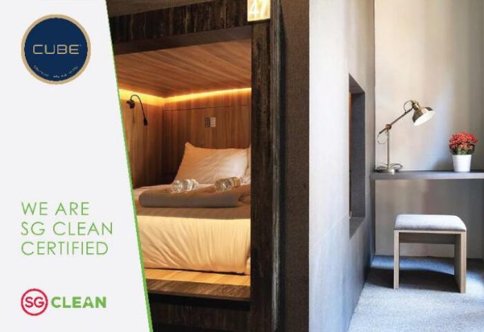 Cube Boutique Capsule Hotel @ Chinatown: Interior view of a gay-friendly capsule with bed, desk, and stool. SG Clean Certified.