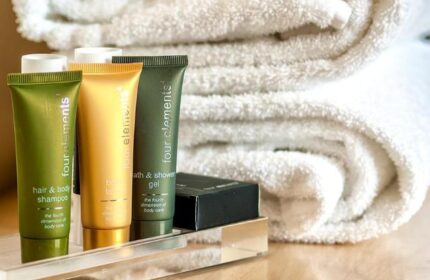 Czech Inn's gay-friendly hotel amenities: four elements hair & body shampoo, bath & shower gel, lotion, and towels. Perfect for gay travelers.