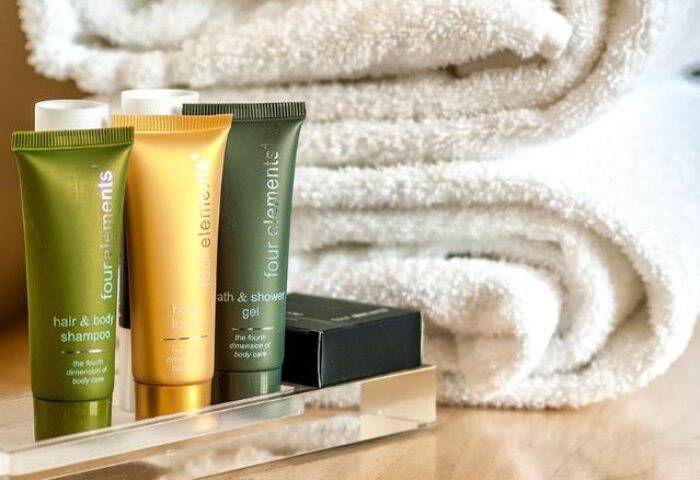 Czech Inn's gay-friendly hotel amenities: four elements hair & body shampoo, bath & shower gel, lotion, and towels. Perfect for gay travelers.