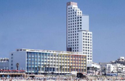 Dan Tel Aviv Hotel, a gay-friendly hotel. Beachfront view of the hotel, a popular destination for gay travelers in Tel Aviv, Israel.