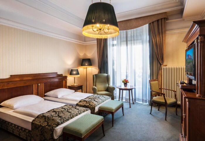 Danubius Hotel Gellert gay-friendly room. Two twin beds, sitting area, and a TV. A great choice for gay travelers in Budapest, Hungary.