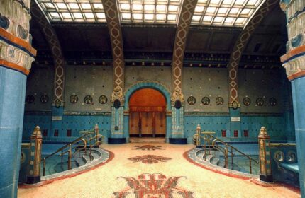 Interior of Danubius Hotel Gellert, a gay-friendly hotel in Budapest. Art Nouveau architecture with blue tile and mosaic floors. Thermal bath detail.