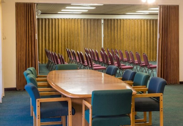Conference room at Days Inn by Wyndham Palm Springs, a gay-friendly hotel. Meeting space with large table and chairs for events.