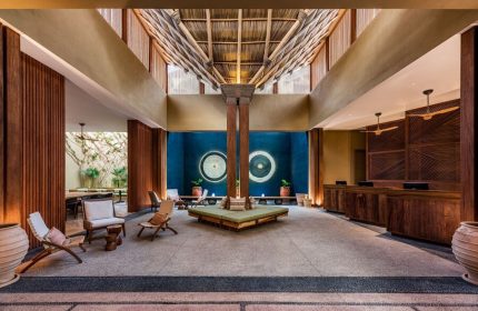 Delta Hotels by Marriott Riviera Nayarit All-Inclusive lobby. Gay-friendly hotel interior with wooden accents and a unique ceiling design.