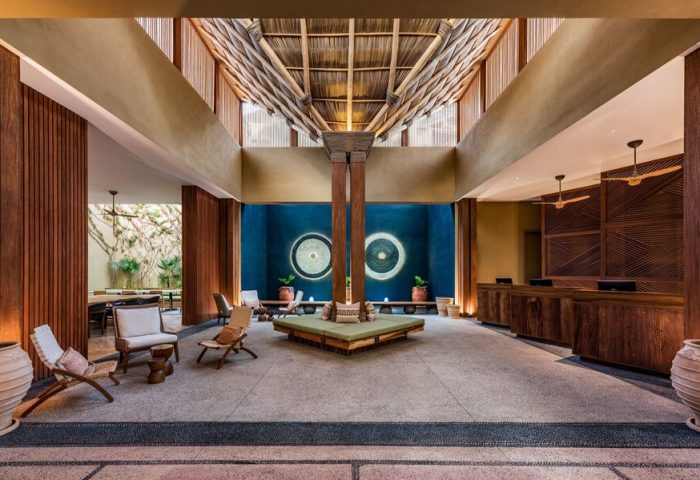 Delta Hotels by Marriott Riviera Nayarit All-Inclusive lobby. Gay-friendly hotel interior with wooden accents and a unique ceiling design.