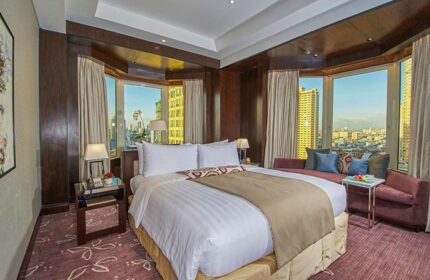 Diamond Hotel room: Gay-friendly hotel with city view. Luxurious bedroom, natural light, modern design. Perfect for gay travel, relaxing stay.