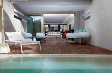 Double-Six Luxury Hotel Seminyak room with pool. Gay-friendly hotel, offers stylish accommodations for LGBTQ+ travelers in Seminyak, Bali.