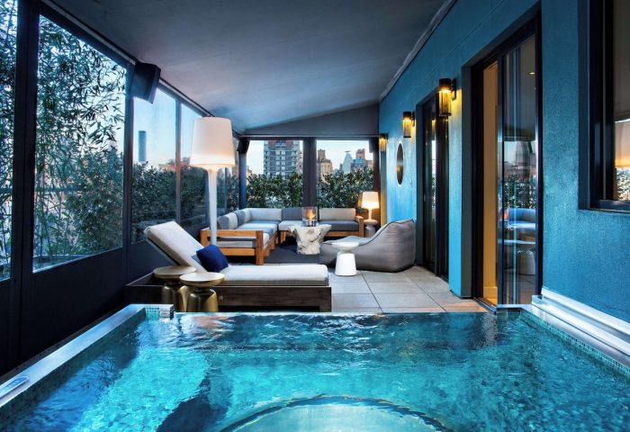 Dream Downtown Hotel's gay-friendly suite with a private plunge pool, lounge seating, and city views. Luxurious travel for gay men.