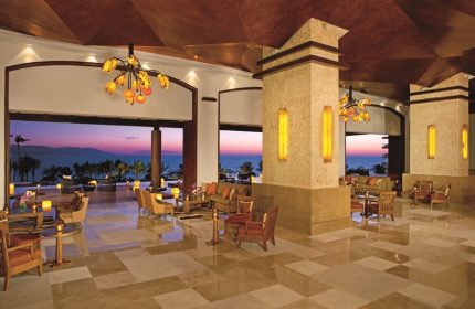 Dreams Vallarta Bay Resort & Spa lobby at sunset. Gay-friendly, all-inclusive hotel with ocean views. Ideal for gay travel.