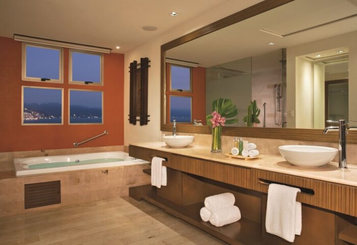 Dreams Vallarta Bay Resort & Spa bathroom. All-inclusive, gay-friendly hotel with jacuzzi tub and ocean view. Luxury travel for gay men.