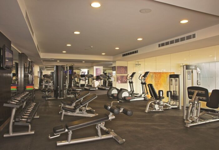 Gym at Dreams Vallarta Bay Resort & Spa, an all-inclusive, gay-friendly hotel. Fitness equipment includes weights, treadmills, and elliptical machines.