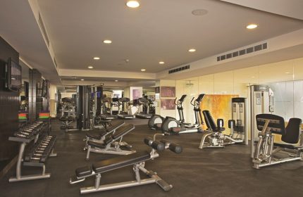 Gym at Dreams Vallarta Bay Resort & Spa, an all-inclusive, gay-friendly hotel. Fitness equipment includes weights, treadmills, and elliptical machines.