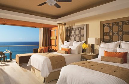 Dreams Vallarta Bay Resort & Spa all-inclusive gay-friendly hotel: Ocean view suite with two beds and balcony overlooking the sea.
