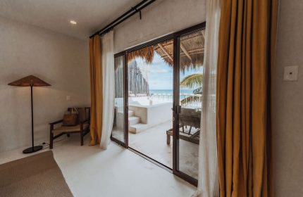 Dune Boutique Hotel room at the party zone. Gay-friendly hotel with ocean view, balcony, & beach access. Ideal for gay men's travel.