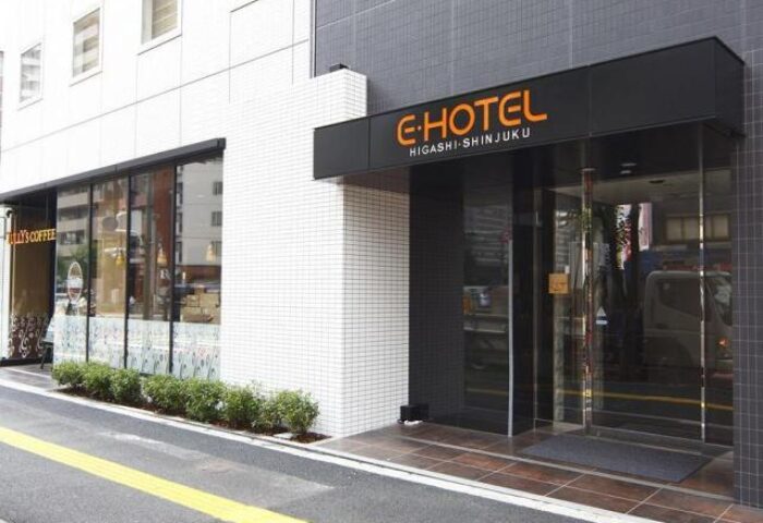 E-Hotel Higashi Shinjuku Tokyo entrance. Gay-friendly hotel in Tokyo's Shinjuku district. Modern architecture, clean lines, and welcoming entrance.