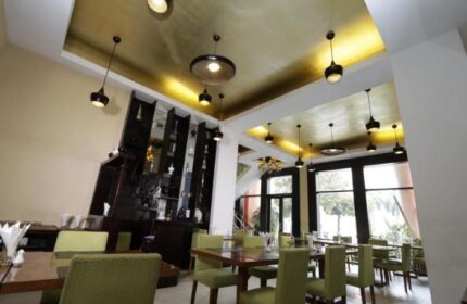 East Hotel's gay-friendly restaurant featuring modern lighting, sleek furniture, and a stylish bar area. A great spot for gay travelers.