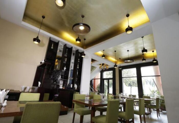 East Hotel's gay-friendly restaurant featuring modern lighting, sleek furniture, and a stylish bar area. A great spot for gay travelers.