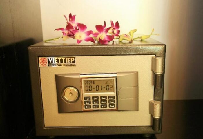 Safe in room at gay-friendly Eclipse Legend Hotel. Digital keypad, flowers on top. Gay travel advice, safe for valuables, peace of mind.