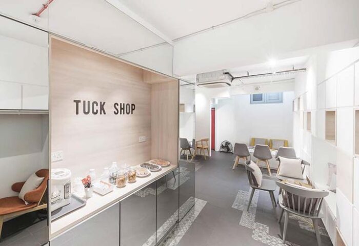 Eighteen By Three Cabins' Tuck Shop. The gay-friendly hotel offers a lounge area with snacks and seating for guests. Modern design.