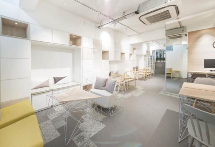 Eighteen By Three Cabins interior. Modern design, light wood tables and chairs. Gay-friendly hotel, stylish, comfortable, and welcoming.
