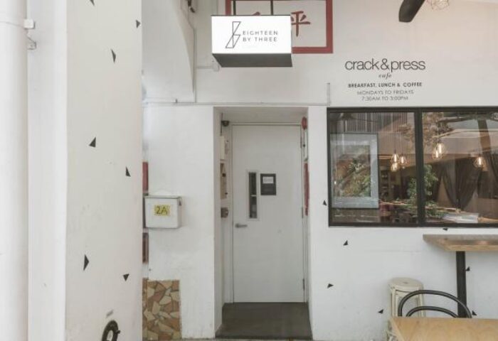 Eighteen By Three Cabins' entrance. Gay-friendly hotel & cafe with breakfast, lunch, and coffee. A great spot for gay men travelers.