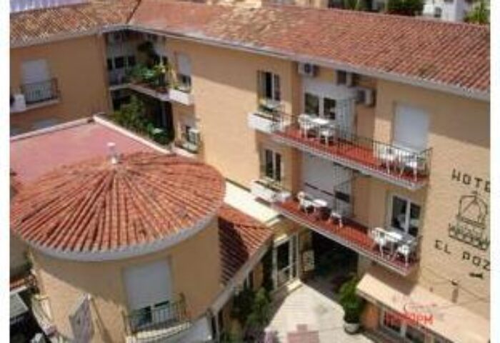 El Pozo, gay-friendly hotel. Exterior view of the hotel building with balconies. Gay travel advice for finding welcoming accommodations.