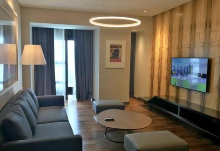 Element Kuala Lumpur hotel suite. Living room with sofa, TV, and modern decor. A gay-friendly hotel for LGBT travelers.