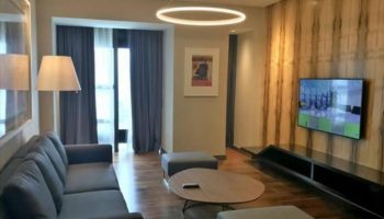Element Kuala Lumpur hotel suite. Living room with sofa, TV, and modern decor. A gay-friendly hotel for LGBT travelers.