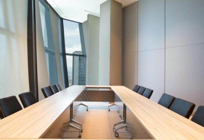 Element Kuala Lumpur's meeting room with a U-shaped table, chairs, and a window view. A gay-friendly hotel for travelers.